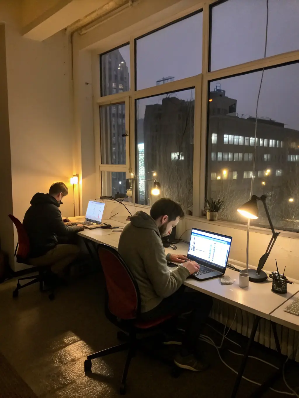 A bustling office environment with employees using high-speed internet, demonstrating the benefits of Xgen Networks' commercial fiber solutions.